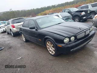 2004 Jaguar XJ with VIN SAJEA71C34SG10171, listed as a IAAI auction lot 41412081 with 150,488 mi miles. Bid and sale history available at carsss.com. Image 1.