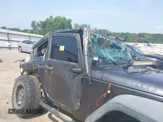 2014 Jeep Wrangler Sport with VIN 1C4AJWAGXEL233647, listed as a IAAI auction lot 39993785 with Not Provided miles and . Bid and sale history available at DreamBid. Image 22.