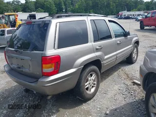1999 Jeep Grand Cherokee Limited with VIN 1J4GW68N9XC808639, listed as a IAAI auction lot 42521785 with 156,864 mi miles and . Bid and sale history available at DreamBid. Image 4.