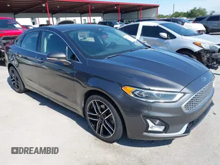 2019 Ford Fusion Titanium with VIN 3FA6P0D91KR104827, listed as a IAAI auction lot 42221526 with 141,316 mi miles and . Bid and sale history available at DreamBid. Image 1.