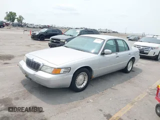 1999 Mercury Grand Marquis LS z VIN 2MEFM75W7XX659031, wystawiony jako IAAI lot #42362387 z przebiegiem 140 067 mil mil oraz . Historia ofert i sprzedaży dostępna na DreamBid. Obrazek 2.