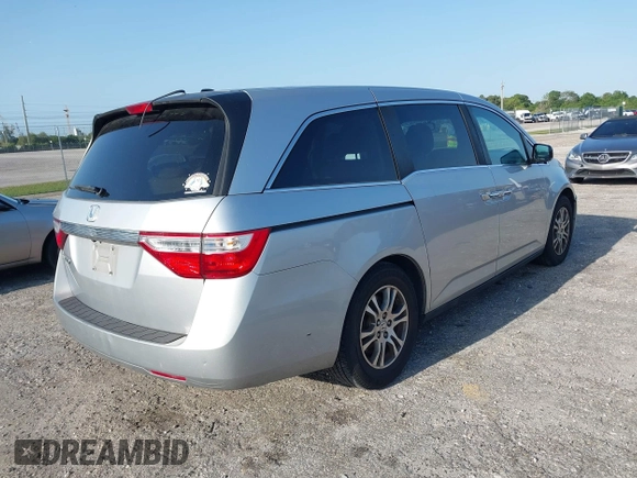 2013 Honda Odyssey EX-L with VIN 5FNRL5H67DB008575, listed as a IAAI auction lot 42008315 with 131,984 mi miles and . Bid and sale history available at carsss.com. Image 4.