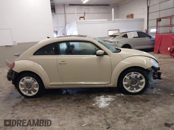 2019 Volkswagen Beetle S with VIN 3VWFD7ATXKM705322, listed as a IAAI auction lot 41409600 with 97,479 mi miles. Bid and sale history available at carsss.com. Image 14.