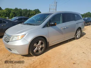2012 Honda Odyssey Touring с VIN 5FNRL5H93CB137468, выставлен на аукционе Copart как лот 59330545 с пробегом 105 880 миль миль и Списание • Salvage title. История ставок и продаж доступна на DreamBid. Изображение 1.