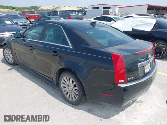 2013 Cadillac CTS Luxury with VIN 1G6DE5E50D0101763, listed as a IAAI auction lot 42090577 with 105,097 mi miles and . Bid and sale history available at DreamBid. Image 3.