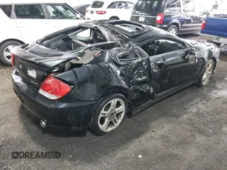 2005 Hyundai Tiburon GT z VIN KMHHN65F45U184777, wystawiony jako IAAI lot #42190342 z przebiegiem 213 013 mil mil oraz . Historia ofert i sprzedaży dostępna na DreamBid. Obrazek 4.