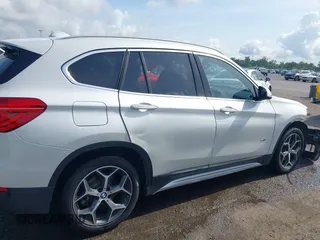2018 BMW X1 sDrive28i z VIN WBXHU7C34J5H40814, wystawiony jako IAAI lot #42291108 z przebiegiem 93 200 mil mil oraz . Historia ofert i sprzedaży dostępna na DreamBid. Obrazek 13.