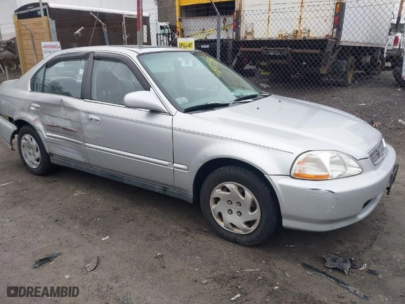 1997 Honda Civic EX with VIN 2HGEJ8643VH561244, listed as a IAAI auction lot 41810988 with 130,000 mi miles. Bid and sale history available at carsss.com. Image 1.