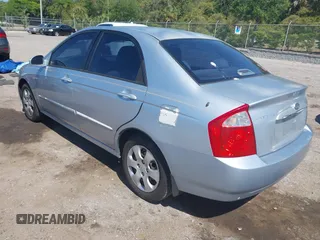 2005 Kia Spectra LX with VIN KNAFE121955107403, listed as a IAAI auction lot 42055036 with 157,605 mi miles. Bid and sale history available at carsss.com. Image 3.