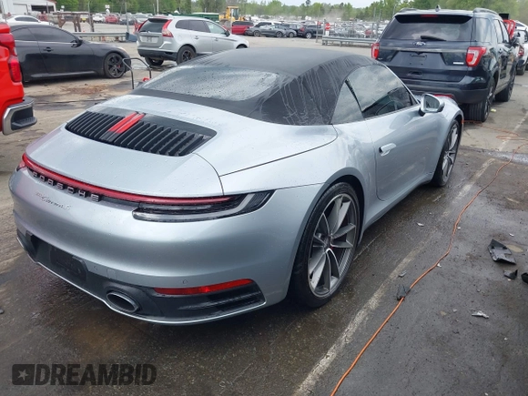 2020 Porsche 911 Carrera S with VIN WP0CB2A97LS262106, listed as a IAAI auction lot 42011151 with 63,444 mi miles. Bid and sale history available at carsss.com. Image 4.