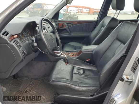 1999 Mercedes-Benz E-Class with VIN WDBJF65H0XA797390, listed as a Copart auction lot 55081405 with 80,950 mi miles and Salvage Title. Bid and sale history available at carsss.com. Image 7.