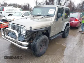 2006 Jeep Wrangler Sport Right Hand Drive with VIN 1J4F449S06P725862, listed as a IAAI auction lot 41562989 with 121,997 mi miles. Bid and sale history available at carsss.com. Image 2.