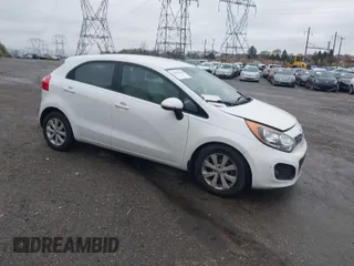 2013 Kia Rio SX with VIN KNADN5A34D6245263, listed as a IAAI auction lot 41976166 with 101,438 mi miles. Bid and sale history available at carsss.com. Image 1.