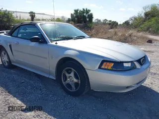2003 Ford Mustang Deluxe z VIN 1FAFP44453F379157, wystawiony jako IAAI lot #41612382 z przebiegiem 107 599 mil mil oraz . Historia ofert i sprzedaży dostępna na DreamBid. Obrazek 1.
