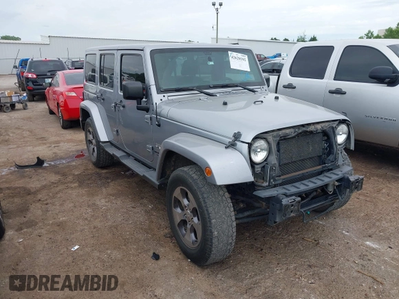 2016 Jeep Wrangler Unlimited Sahara z VIN 1C4BJWEGXGL280016, wystawiony jako IAAI lot #42620102 z przebiegiem 128 232 mil mil oraz . Historia ofert i sprzedaży dostępna na DreamBid. Obrazek 1.