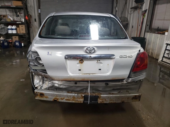 2003 Toyota ECHO with VIN JTDBT123735040712, listed as a Copart auction lot 82827834 with NaN miles and Salvage Title. Bid and sale history available at carsss.com. Image 6.