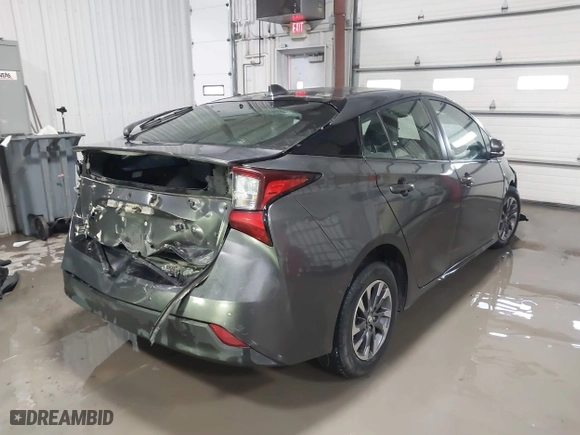 2021 Toyota Prius L Eco with VIN JTDKAMFU9M3132587, listed as a IAAI auction lot 41637275 with 84,203 mi miles. Bid and sale history available at carsss.com. Image 4.