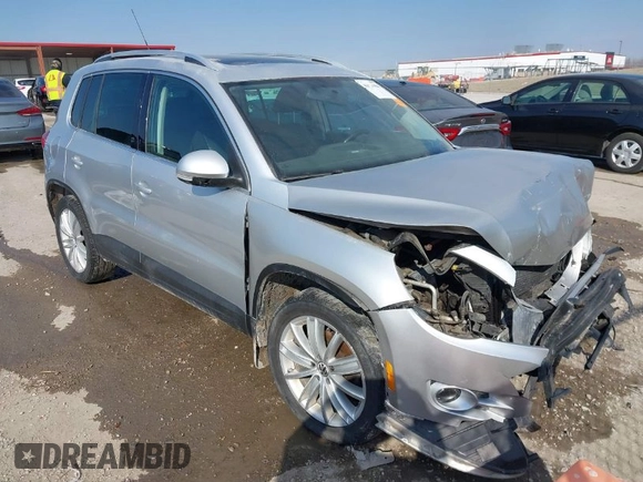 2011 Volkswagen Tiguan SE with VIN WVGBV7AX2BW562055, listed as a IAAI auction lot 41642084 with 175,407 mi miles and . Bid and sale history available at DreamBid. Image 1.