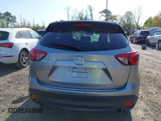 2014 Mazda CX-5 Touring with VIN JM3KE4CY0E0302583, listed as a IAAI auction lot 41947735 with 122,077 mi miles. Bid and sale history available at carsss.com. Image 16.