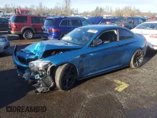 2018 BMW M2 with VIN WBS1J5C59JVD36008, listed as a Copart auction lot 87876685 with 24,255 mi miles and Salvage Title. Bid and sale history available at carsss.com. Image 1.