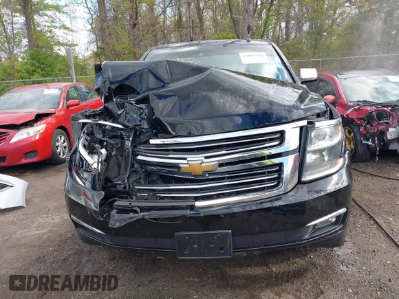 2015 Chevrolet Suburban LTZ with VIN 1GNSKKKC5FR255373, listed as a IAAI auction lot 42012528 with 219,030 mi miles and . Bid and sale history available at DreamBid. Image 12.
