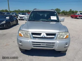 2003 Mitsubishi Montero LTD with VIN JA4NW51S53J030850, listed as a IAAI auction lot 42063733 with 210,810 mi miles. Bid and sale history available at carsss.com. Image 6.
