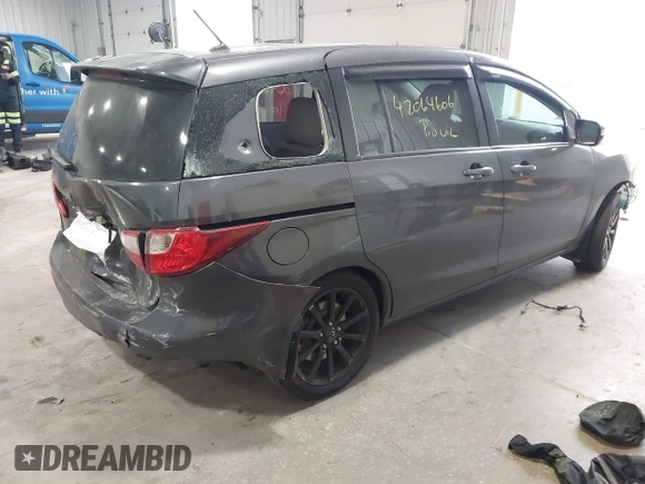 2014 Mazda 5 Sport z VIN JM1CW2BLXE0164748, wystawiony jako IAAI lot #42064606 z przebiegiem 140 169 mil mil oraz . Historia ofert i sprzedaży dostępna na DreamBid. Obrazek 4.