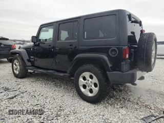 2015 Jeep Wrangler Unlimited Sahara with VIN 1C4BJWEGXFL606573, listed as a Copart auction lot 83983894 with 103,314 mi miles and Clean title. Bid and sale history available at DreamBid. Image 2.