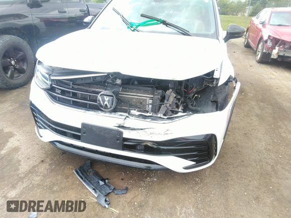 2022 Volkswagen Tiguan SE R-Line Black z VIN 3VVCB7AX0NM029502, wystawiony jako IAAI lot #40141730 z przebiegiem 41 362 mil mil oraz . Historia ofert i sprzedaży dostępna na DreamBid. Obrazek 6.
