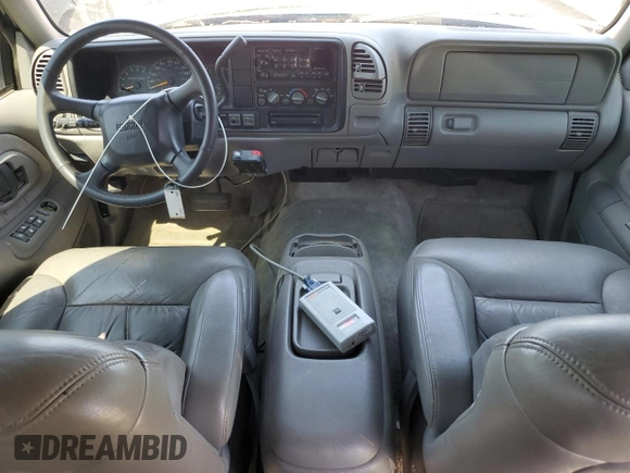 1999 GMC Suburban z VIN 3GKFK16R2XG544767, wystawiony jako Copart lot #67078414 z przebiegiem 154 145 mil mil oraz Szkoda całkowita • Salvage title. Historia ofert i sprzedaży dostępna na DreamBid. Obrazek 8.