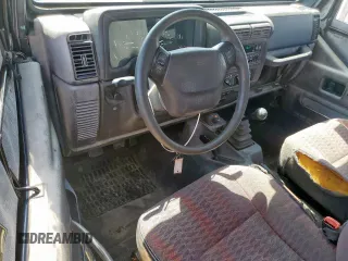 2000 Jeep Wrangler Sport with VIN 1J4FA49S9YP742414, listed as a Copart auction lot 61471065 with 139,572 mi miles and Clean title. Bid and sale history available at DreamBid. Image 8.