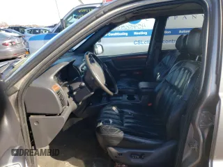 1999 Jeep Grand Cherokee Limited with VIN 1J4GW68N8XC770353, listed as a Copart auction lot 74670614 with Not provided miles and Non repairable. Bid and sale history available at DreamBid. Image 7.