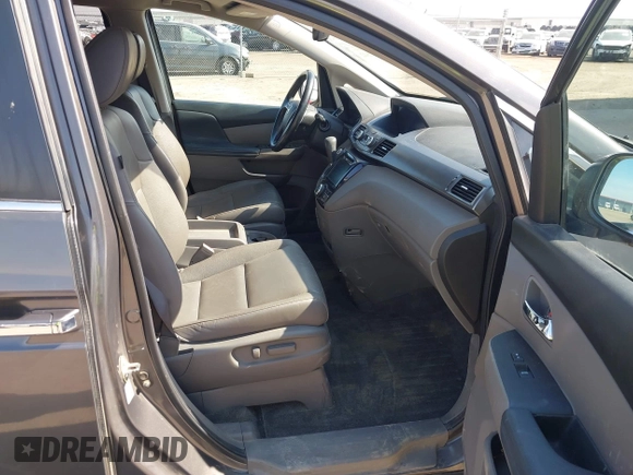 2014 Honda Odyssey EX-L z VIN 5FNRL5H64EB031426, wystawiony jako IAAI lot #41777542 z przebiegiem 162 426 mil mil oraz . Historia ofert i sprzedaży dostępna na DreamBid. Obrazek 5.