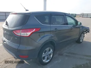 2015 Ford Escape SE with VIN 1FMCU0G73FUA77673, listed as a IAAI auction lot 41988290 with 176,734 mi miles. Bid and sale history available at carsss.com. Image 4.