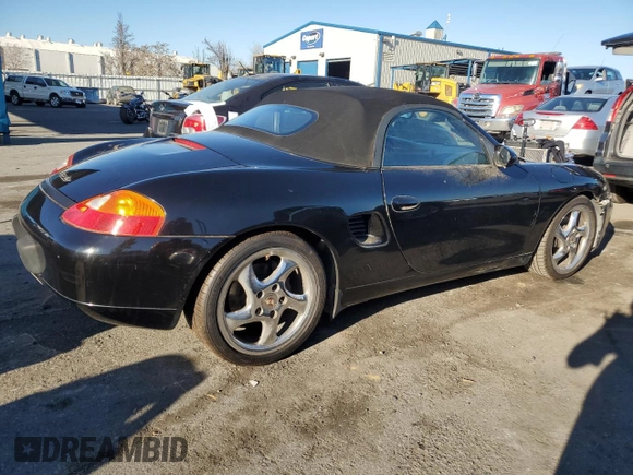 2000 Porsche Boxster z VIN WP0CA2983YU621686, wystawiony jako Copart lot #88951585 z przebiegiem 127 276 mil mil oraz Tytuł czysty. Historia ofert i sprzedaży dostępna na DreamBid. Obrazek 3.