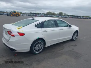 2015 Ford Fusion SE z VIN 3FA6P0H9XFR294210, wystawiony jako IAAI lot #42187211 z przebiegiem 171 326 mil mil oraz . Historia ofert i sprzedaży dostępna na DreamBid. Obrazek 4.