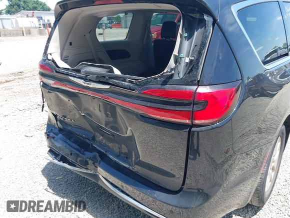 2023 Chrysler Pacifica Touring L with VIN 2C4RC1BG1PR606504, listed as a IAAI auction lot 42647652 with 41,598 mi miles and . Bid and sale history available at DreamBid. Image 6.