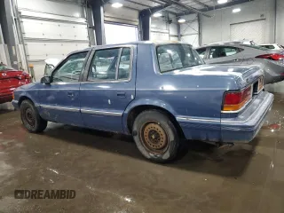 1991 Dodge Spirit z VIN 1B3XA46K9MF628235, wystawiony jako Copart lot #83581274 z przebiegiem 117 774 mil mil oraz Szkody całkowita. Historia ofert i sprzedaży dostępna na DreamBid. Obrazek 2.