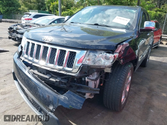 2013 Jeep Grand Cherokee Overland with VIN 1C4RJECT3DC526005, listed as a IAAI auction lot 42064151 with 112,777 mi miles and . Bid and sale history available at DreamBid. Image 6.