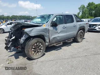 2022 Nissan Frontier Pro-4X with VIN 1N6ED1EK0NN665496, listed as a Copart auction lot 57011405 with 50,275 mi miles and Salvage title. Bid and sale history available at DreamBid. Image 1.