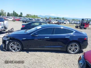 2014 Tesla Model S 60 with VIN 5YJSA1H18EFP31969, listed as a IAAI auction lot 42312485 with 90,043 mi miles and . Bid and sale history available at DreamBid. Image 15.