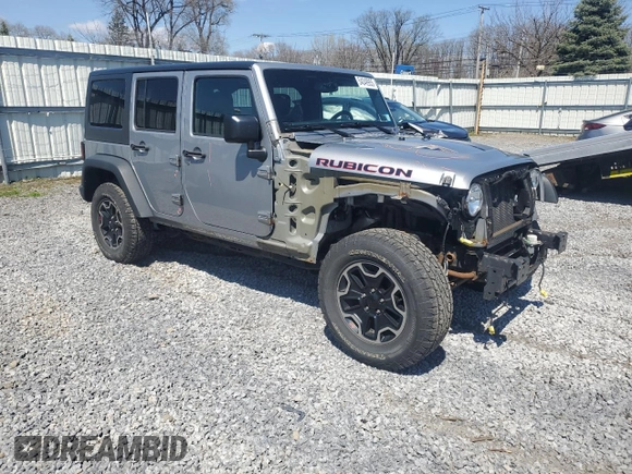 2015 Jeep Wrangler Unlimited Rubicon Hard Rock with VIN 1C4HJWFG2FL686556, listed as a Copart auction lot 54049955 with 126,675 mi miles and Salvage title. Bid and sale history available at DreamBid. Image 4.