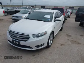 2013 Ford Taurus SEL with VIN 1FAHP2E87DG111530, listed as a IAAI auction lot 41322957 with 183,103 mi miles. Bid and sale history available at carsss.com. Image 2.