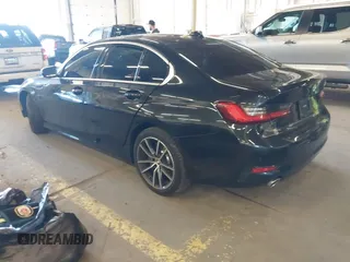 2021 BMW 3 Series 330i with VIN 3MW5R1J06M8C17805, listed as a IAAI auction lot 41736509 with 60,811 mi miles. Bid and sale history available at carsss.com. Image 3.