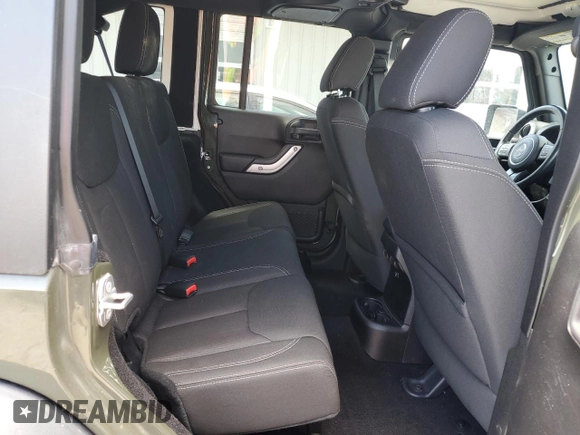 2015 Jeep Wrangler Unlimited Rubicon with VIN 1C4BJWFGXFL752602, listed as a Copart auction lot 54102395 with 26,466 mi miles and Salvage title. Bid and sale history available at DreamBid. Image 11.