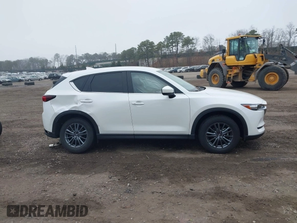 2021 Mazda CX-5 Touring with VIN JM3KFBCM1M1446313, listed as a IAAI auction lot 41930330 with 28,610 mi miles. Bid and sale history available at carsss.com. Image 13.