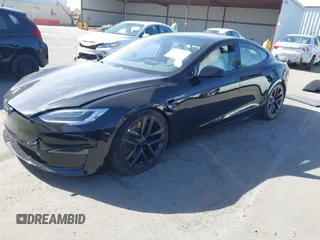 2022 Tesla Model S Plaid with VIN 5YJSA1E62NF460634, listed as a IAAI auction lot 41372644 with 16,050 mi miles and . Bid and sale history available at DreamBid. Image 17.