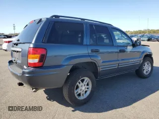 2004 Jeep Grand Cherokee Laredo z VIN 1J4GW48S74C159381, wystawiony jako Copart lot #53972115 z przebiegiem 128 309 mil mil oraz Szkoda całkowita • Salvage title. Historia ofert i sprzedaży dostępna na DreamBid. Obrazek 3.