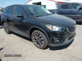 2016 Mazda CX-5 Grand Touring with VIN JM3KE4DY9G0893174, listed as a IAAI auction lot 41887814 with 79,811 mi miles. Bid and sale history available at carsss.com. Image 1.