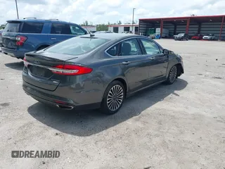 2018 Ford Fusion Titanium with VIN 3FA6P0D9XJR169657, listed as a IAAI auction lot 42392112 with 62,754 mi miles and . Bid and sale history available at DreamBid. Image 4.